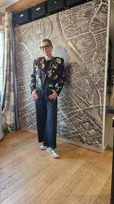 Hallway of Fashion standing in front of Paris Map armoire
