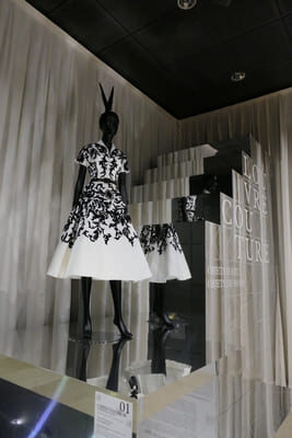 black and white dress on mannequin on mirrored stairs