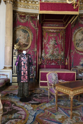 an outfit in a luxurious room in the Louvre